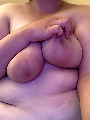 Immoral plump lady is fingering her holes