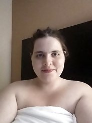 A gallery of explicit images featuring a mature woman indulging in her desire for a large black penis, while her partner is present