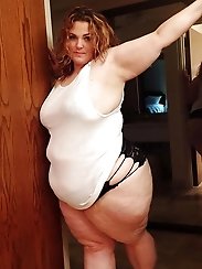Juicy BBW chick is posing almost undressed