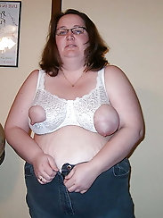 Tattooed plump m-i-l-f is fingering her hole